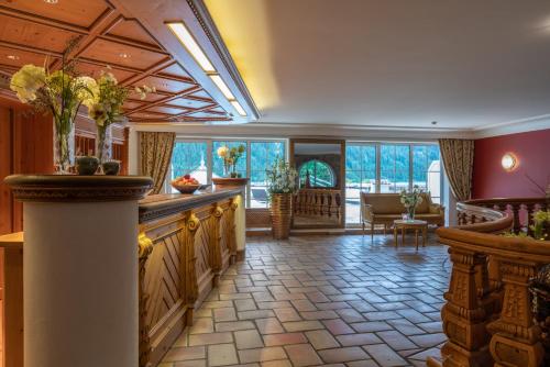 a large room with a kitchen and a living room at Via Salina - Hotel am See - Adults Only in Haldensee