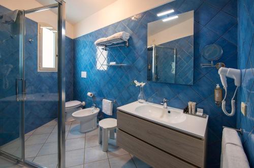 Koupelna v ubytování Boutique Hotel Su Sergenti