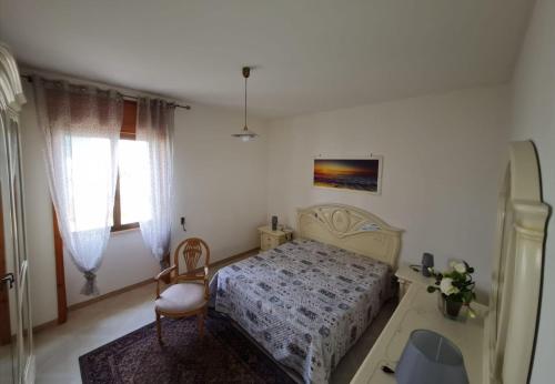 Tempat tidur dalam kamar di Amata Villa Vacanza