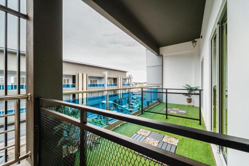 a balcony with a view of a swimming pool at SVOK Hotel in Tawau