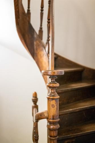a close up of a wooden spiral staircase at Hotel Au Quartier in Maastricht