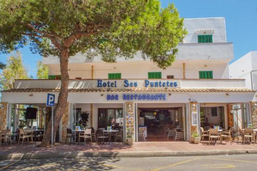 
a building with a sign on the front of it at Hotel Ses Puntetes in Cala d´Or
