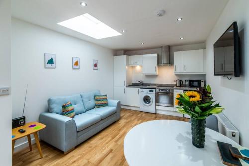 a living room with a couch and a table at Lady Bay Apartments in Nottingham