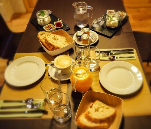a table with plates and glasses of food on it at Hotel do Porto in Muros