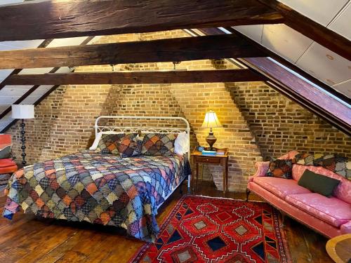 A bed or beds in a room at The Inn at Lincoln Square