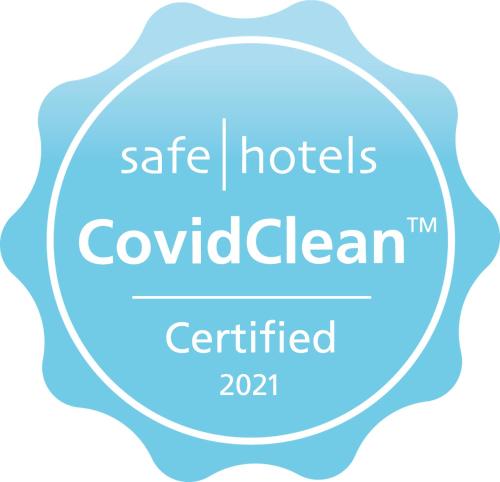 a logo for safe hotels in colombia in a circle at Martin's Manoir in Genval