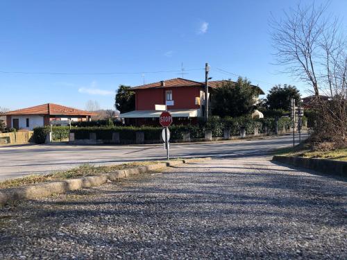 a stop sign on the side of a street at La Locanda Di Perico Paola in Veruno