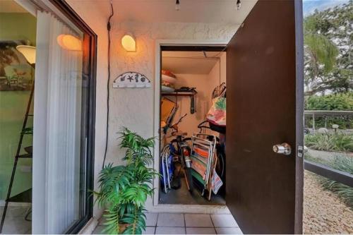 a hallway with a bike parked in a room at Siesta Key Escape Ground Floor Steps to Heated Pool and Free Trolley in Siesta Key