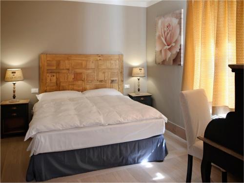 Postel nebo postele na pokoji v ubytování Locanda In Borgo Garnì & Wellness