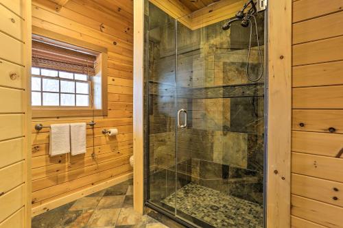 a walk in shower in a log cabin bathroom at Poconos Family Fun Waterfront Cabin with Deck! in Nay Aug