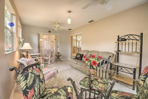 a living room with a couch and a table at Pet-Friendly Home with Yard - 2 Blocks to Beach in Flagler Beach