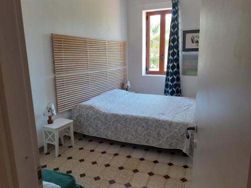 Giường trong phòng chung tại Villa Fumarola