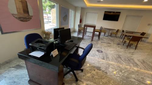 an office with a desk with a printer and chairs at Holiday Inn Express Culiacan by IHG in Culiacán
