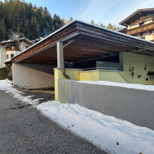 a building with snow in front of it at Appartement Au in Oberperfuss