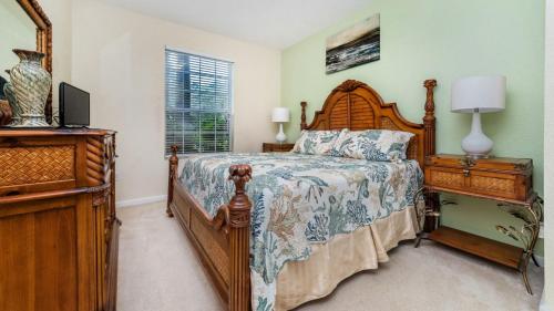 A bed or beds in a room at Beautiful 5 Star Condo on the Prestigious Windsor Hills Resort, Orlando Condo 4791