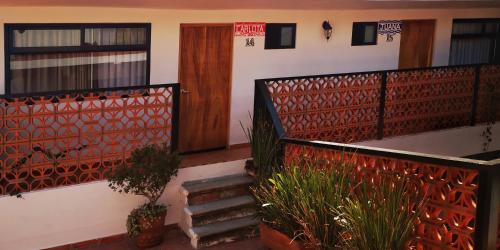 a set of stairs with a door and some plants at Santa Josefita B&B in Cholula