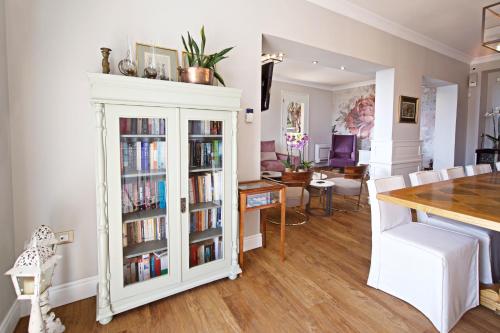 a living room with a book shelf filled with books at Agnantia Bed & Breakfast in Fiskardho