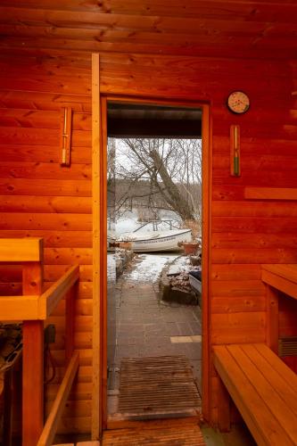 an open door of a log cabin with a window at Drostenhaus Feldberg in Feldberg