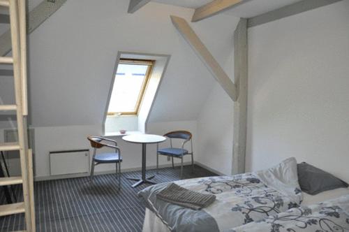 En eller flere senge i et værelse på Lundsgaard Bed & Breakfast