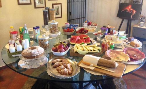 a table with a bunch of food on it at Agriturismo Serra San Biagio in Calatabiano