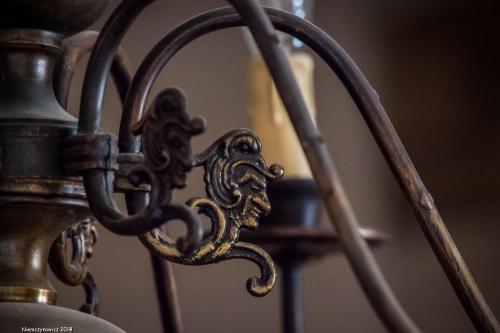 a close up of a metal gate with a latch at Karczma Bełty in Glinno