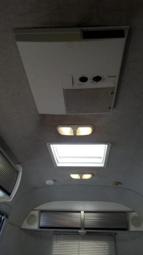 a ceiling with skylights and lights in a building at Airstream in the Center of it All in Miami