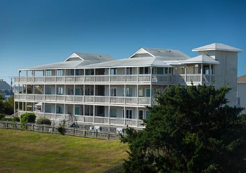 a large white building with a lot of windows at Atlantic Beach Resort, a Ramada by Wyndham in Atlantic Beach