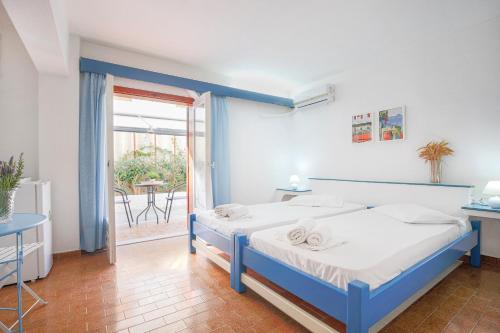 Postel nebo postele na pokoji v ubytování Hotel Asteroa