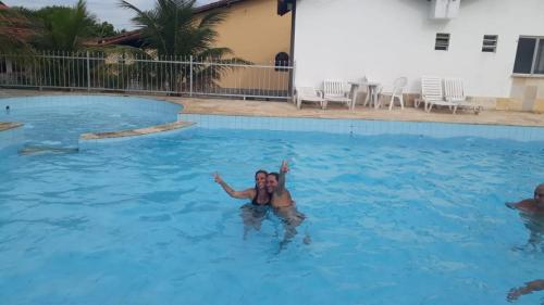 Bazén v ubytování Hotel Pousada Chalé do Coqueiral nebo v jeho okolí