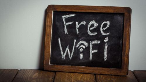 a chalkboard with the free water written on it at Magnuson Hotel Marietta in Marietta