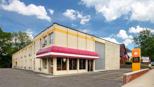 a large building with a red and yellow at M Star North Canton - Hall of Fame in North Canton