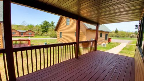 a view from the porch of a log cabin at Jasper Ridge Inn Ishpeming in Ishpeming