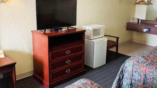 Kuchyň nebo kuchyňský kout v ubytování Black Angus Motel Poteau