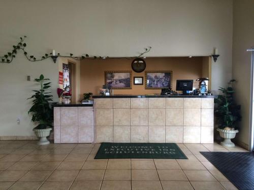 Kuchyň nebo kuchyňský kout v ubytování Executive Inn Schulenburg