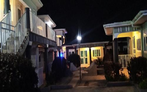 a group of houses at night with a street light at Bethel Resort & Hotels in Gulu