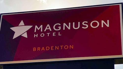 a sign for a marvellous hotel with a white star at Magnuson Hotel Bradenton in Bradenton