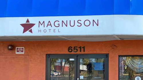 a sign on top of a magellan hotel at Magnuson Hotel Bradenton in Bradenton