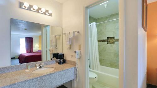 A bathroom at Magnuson Hotel Bradenton