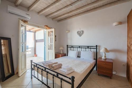 A bed or beds in a room at Natural Stone Villas