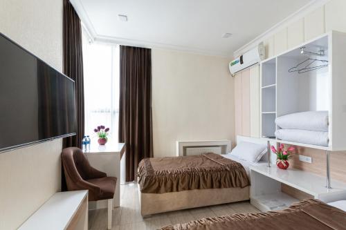 TV a/nebo společenská místnost v ubytování Tantana Hotel