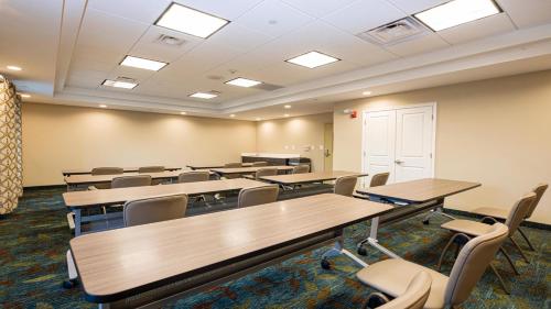 an empty classroom with tables and chairs in it at Candlewood Suites - Dumfries - Quantico by IHG in Dumfries