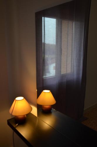 two lamps sitting on a table next to a window at Fly me to Venice in Campalto