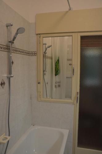 a bathroom with a shower and a sink and a mirror at Fly me to Venice in Campalto