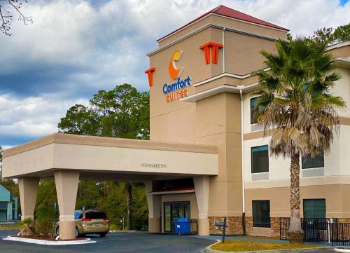 a building with a c dollar stores sign on it at Comfort Suites Kings Bay Naval Base Area in Kingsland