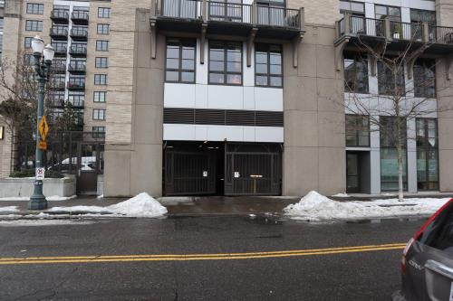 a building with snow on the side of a street at Renu Suites at The Burlington Portland in Portland