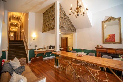 a dining room with a wooden table and chairs at Washington Square Inn in San Francisco