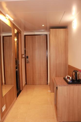 a corridor of a hotel room with a door at Hotel khumani By Hills N Dunes in Udaipur