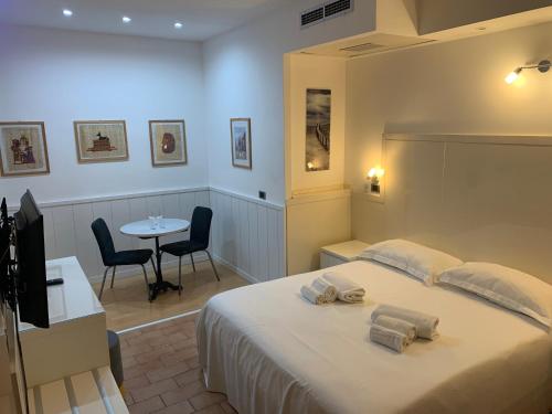 Postel nebo postele na pokoji v ubytování Hotel Malpensafiera