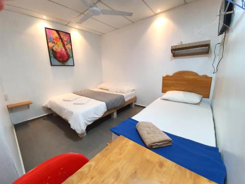 Postel nebo postele na pokoji v ubytování Grand Star Hotel