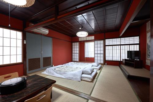 Postel nebo postele na pokoji v ubytování Ryokan Yamamuro